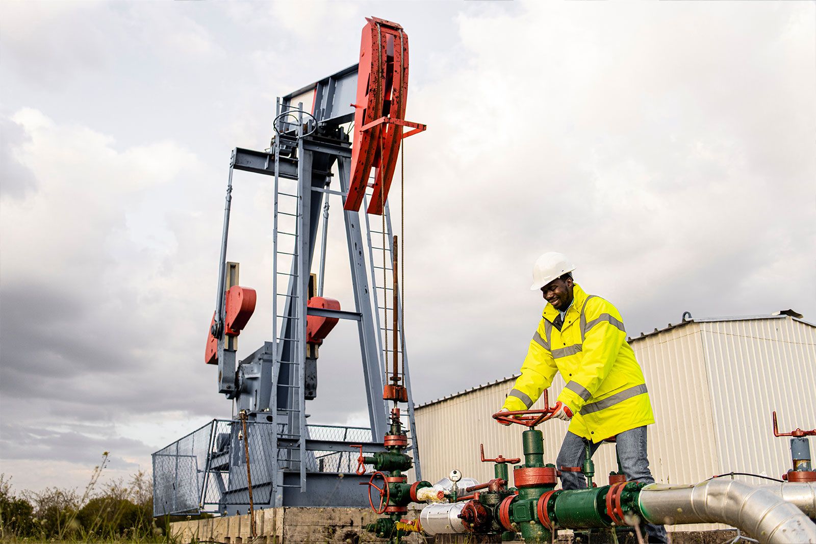 Oil Rig Worker Turning Machine Wheel